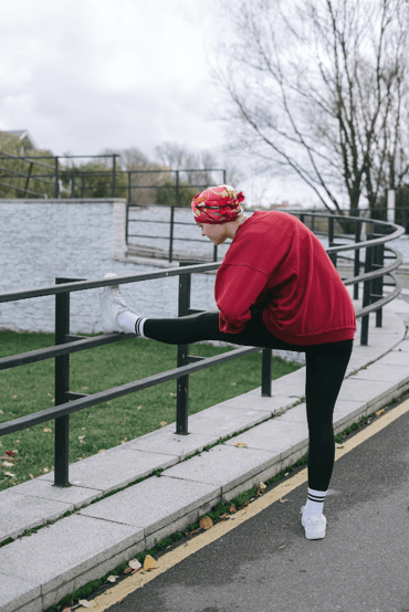 NZ breast cancer - breast cancer survivor stretching her legs/exercising